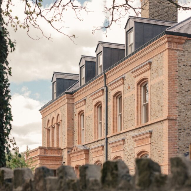 Exterior of Ómós Guesthouse and Restaurant, a restored Victorian red-brick building in Abbeyleix, County Laois.