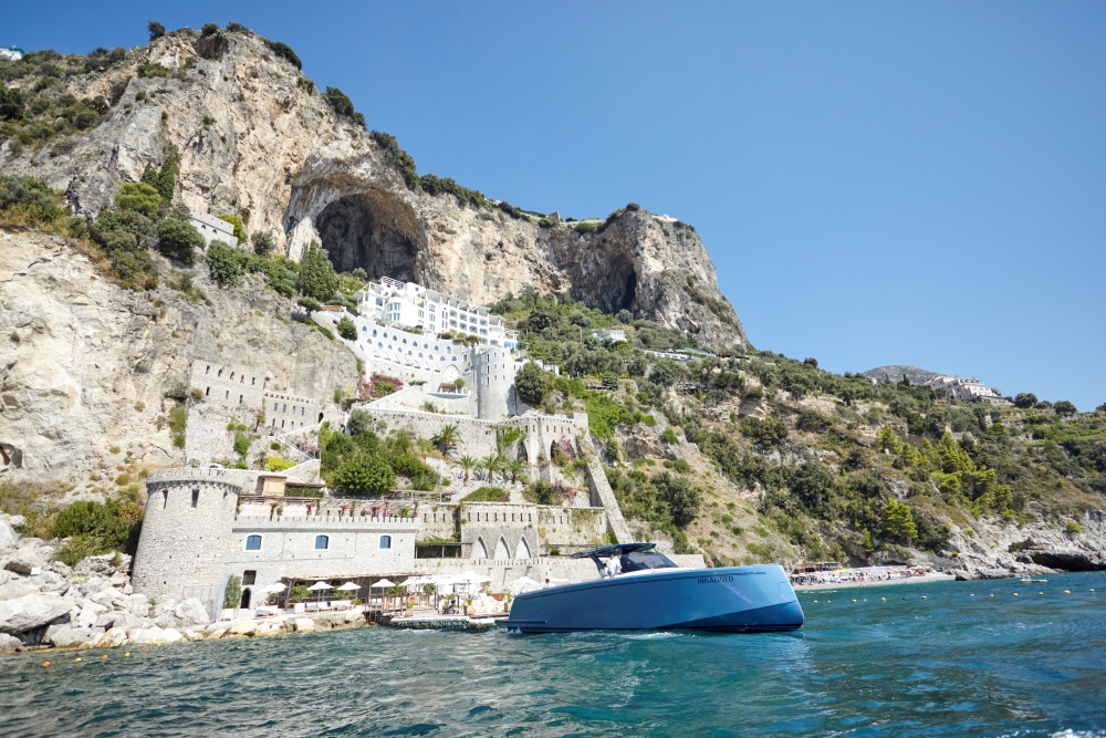 Borgo Santandrea’s private boat moored beside the hotel’s cliffside beach near Amalfi, Italy