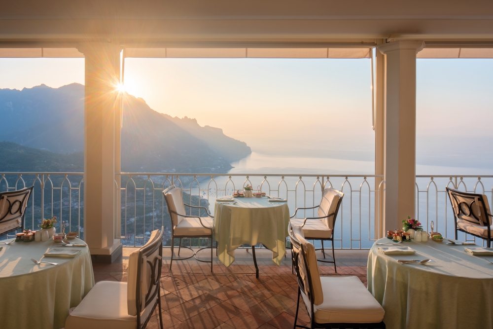 Terrace restaurant at Caruso, A Belmond Hotel, Amalfi Coast, with sunset sea views
