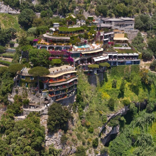 Il San Pietro di Positano hotel on a cliffside above Positano, with terraced gardens and tennis court