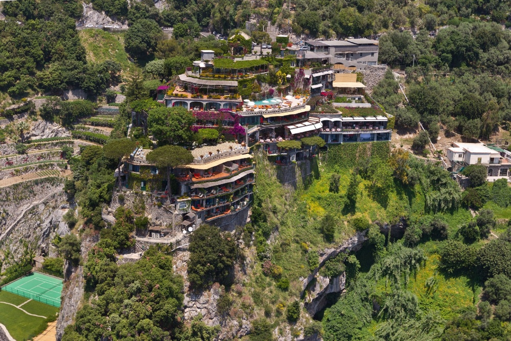Il San Pietro di Positano hotel on a cliffside above Positano, with terraced gardens and tennis court