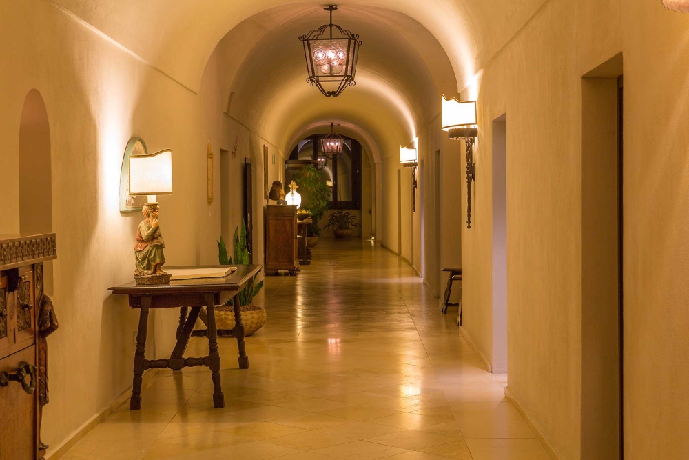 Arched corridor inside Monastero Santa Rosa Hotel and Spa on the Amalfi Coast, Italy
