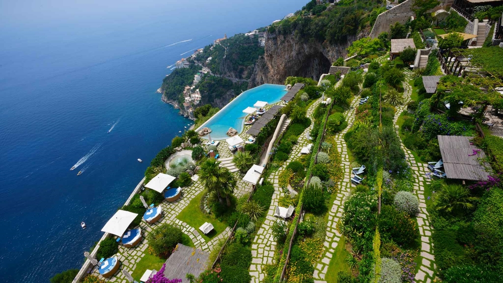 Infinity pool and terraced gardens at Monastero Santa Rosa Hotel and Spa overlooking the Amalfi Coast