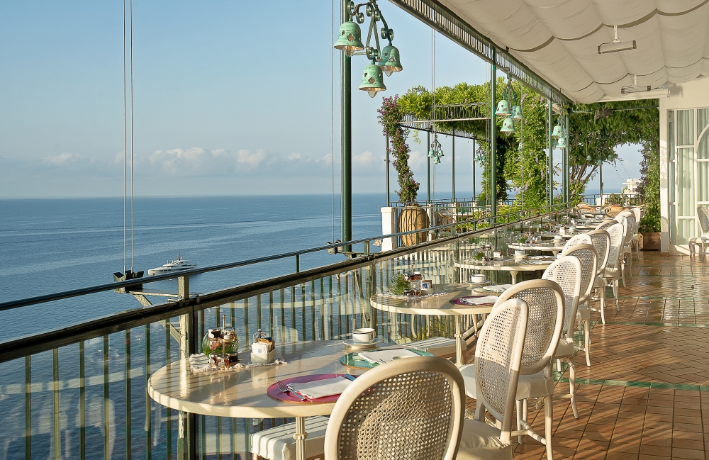 Terrace dining at Ristorante Glicine at Santa Caterina Hotel, overlooking the Mediterranean Sea in Amalfi, Italy