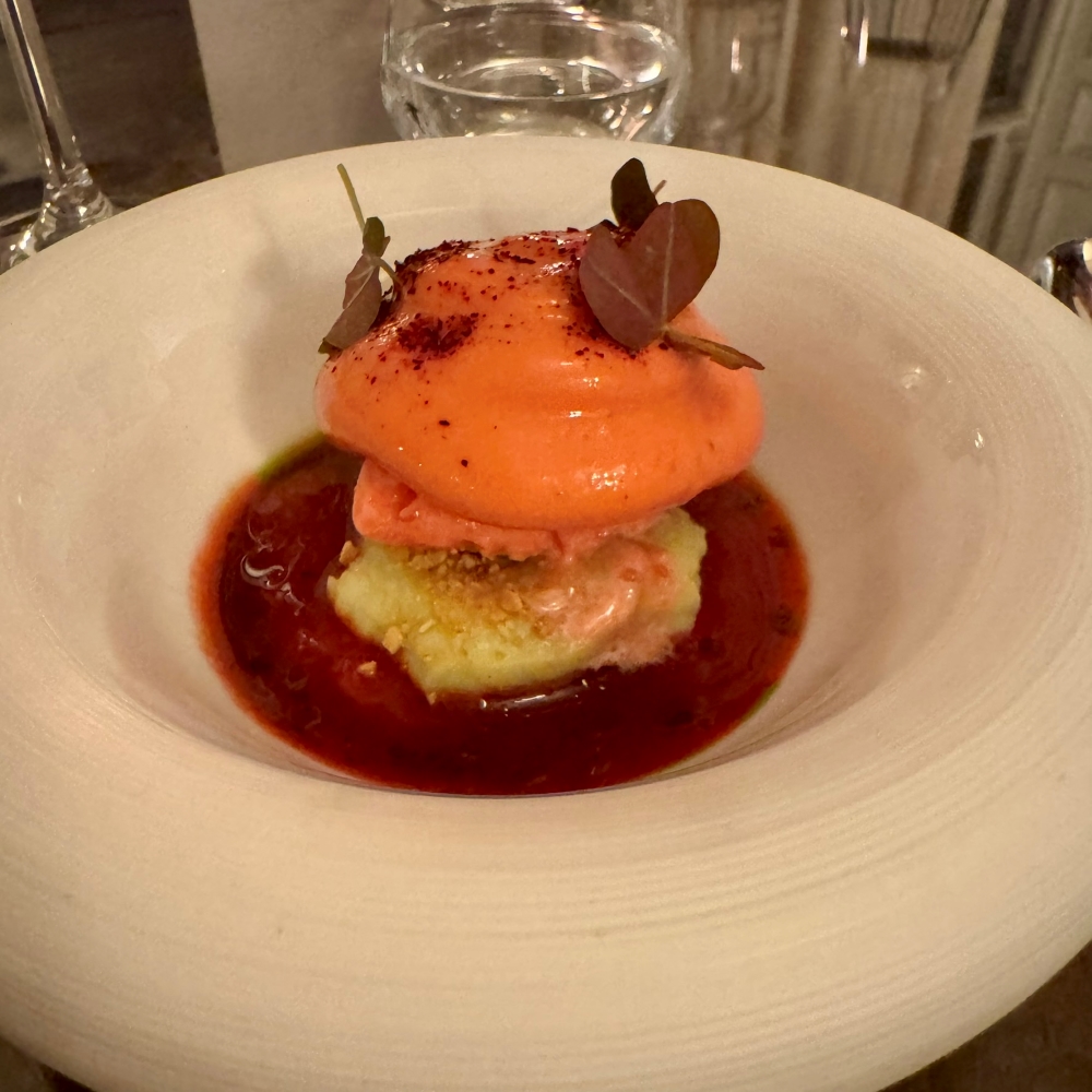 Fine dining dessert at Landline restaurant at Park Hotel Kenmare featuring an orange dessert with fruit and berry sauce